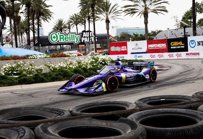 Grosjean speeding through the IndyCar course in his Dale Coyne car.